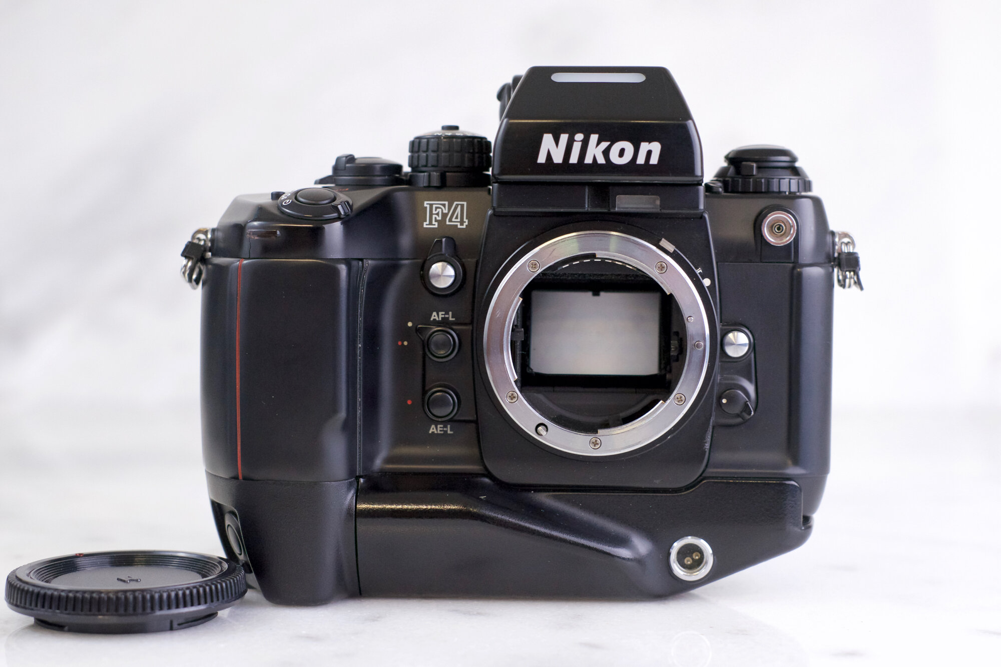 Nikon F4 (F4S) Professional 35mm Film SLR Camera with MB-21 Battery Grip  and DP-20 Prism — F Stop Cameras